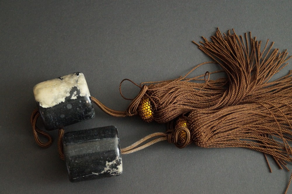 Fuchin decorative weight on a kakemono hanging scroll