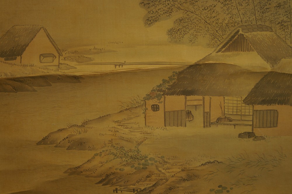 Thatched fishing huts on the shore motif close-up