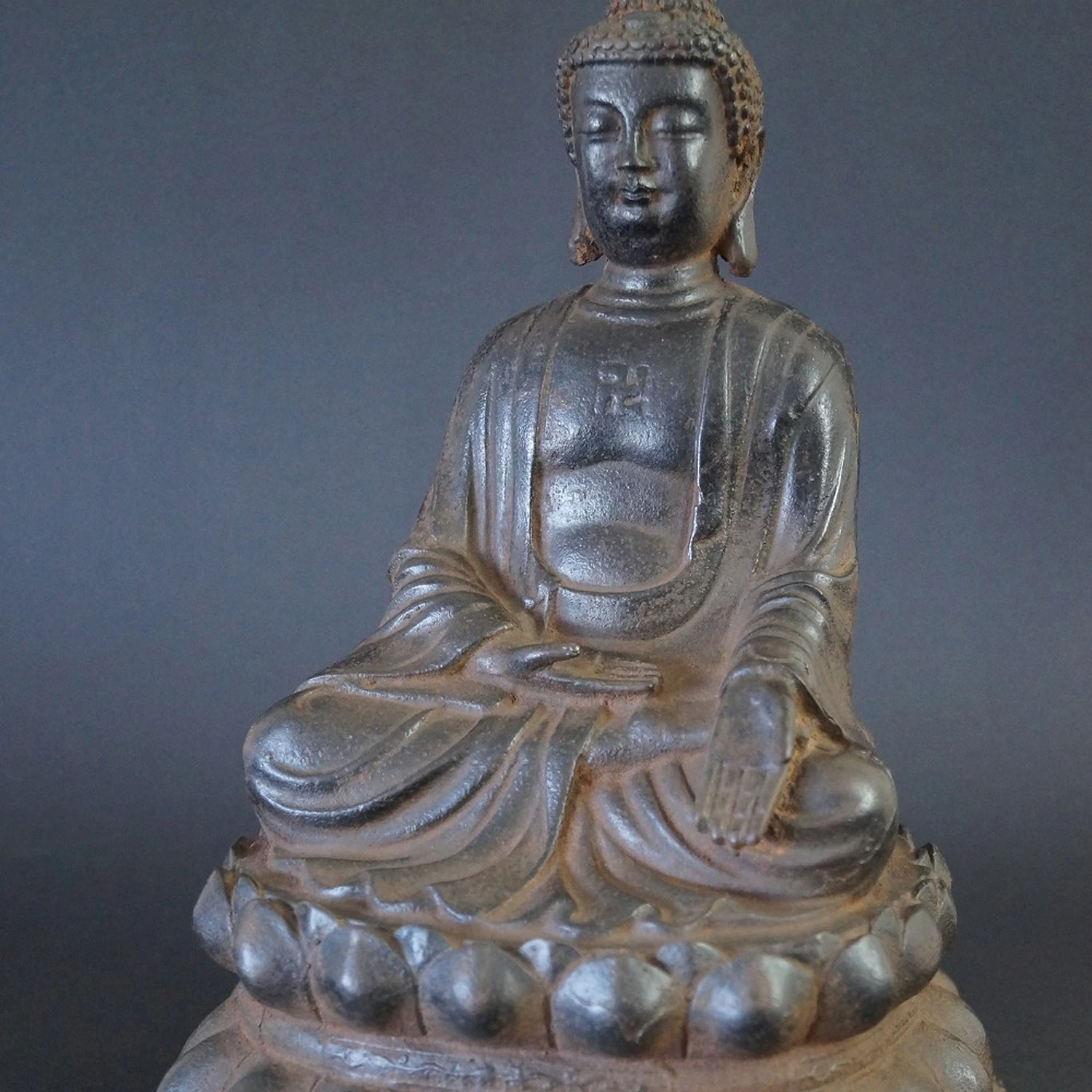 Japanese Buddha figure made of iron motif close-up preview