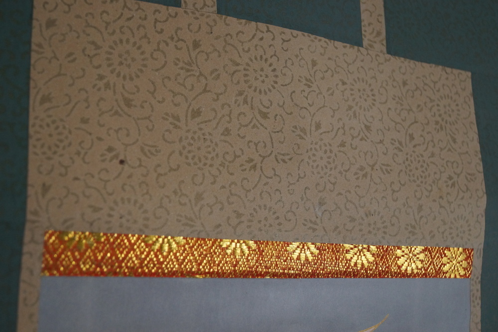 Die 13 Buddhas Nahaufnahme der goldenen Seidenbordueren Montierungsdetail