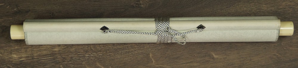 Rolled-up kakemono tied with cord, with wooden jikusaki