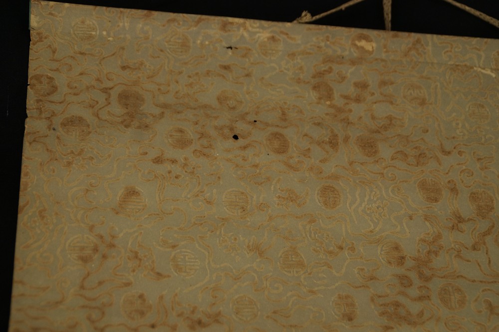 Close-up of the blue-gray border with round medallion pattern