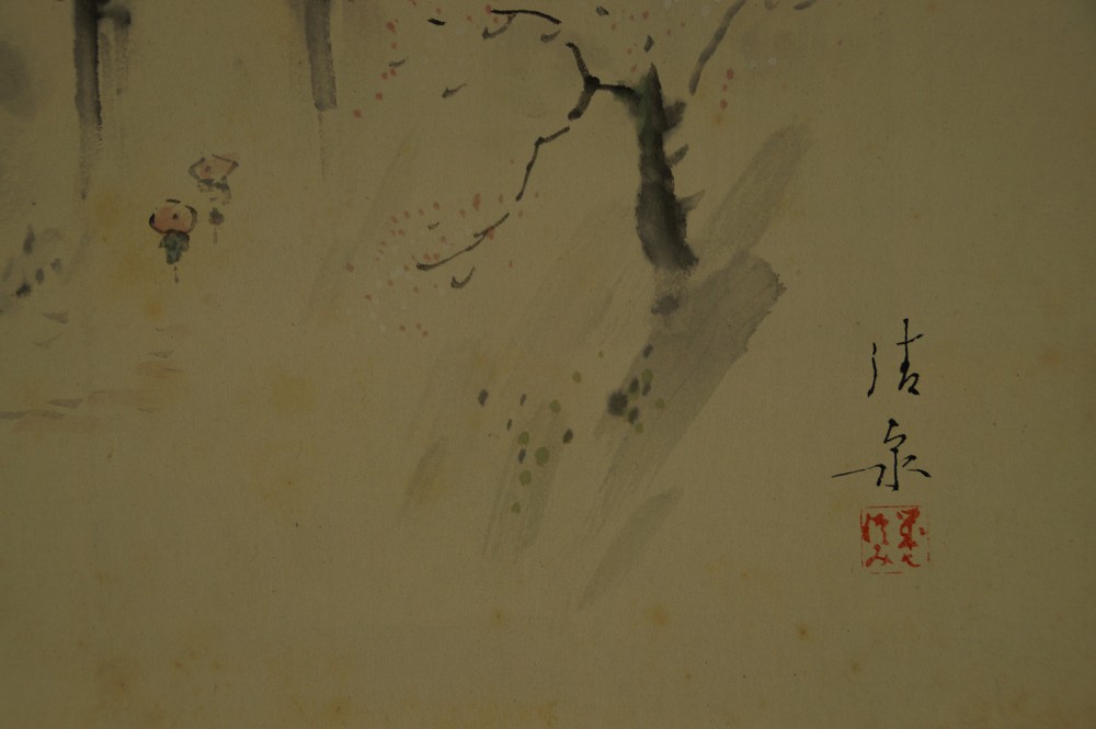 Close-up of the wanderer figure with signature and red artist's seal