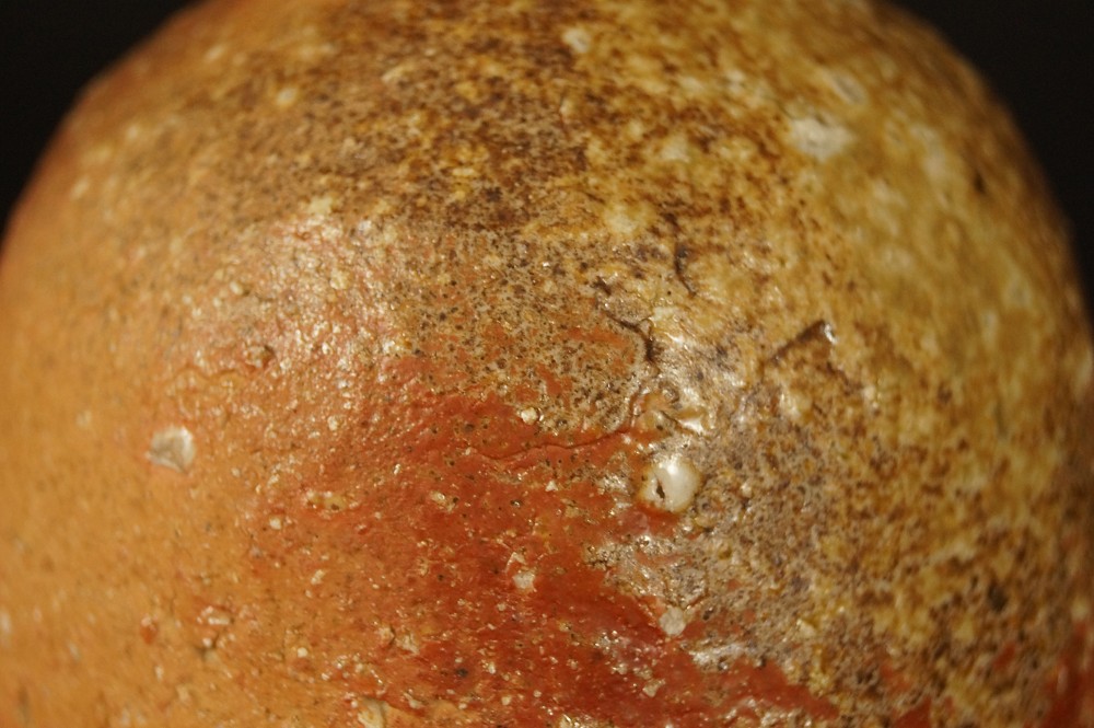 Ash glaze with fire marks on the body glaze close-up