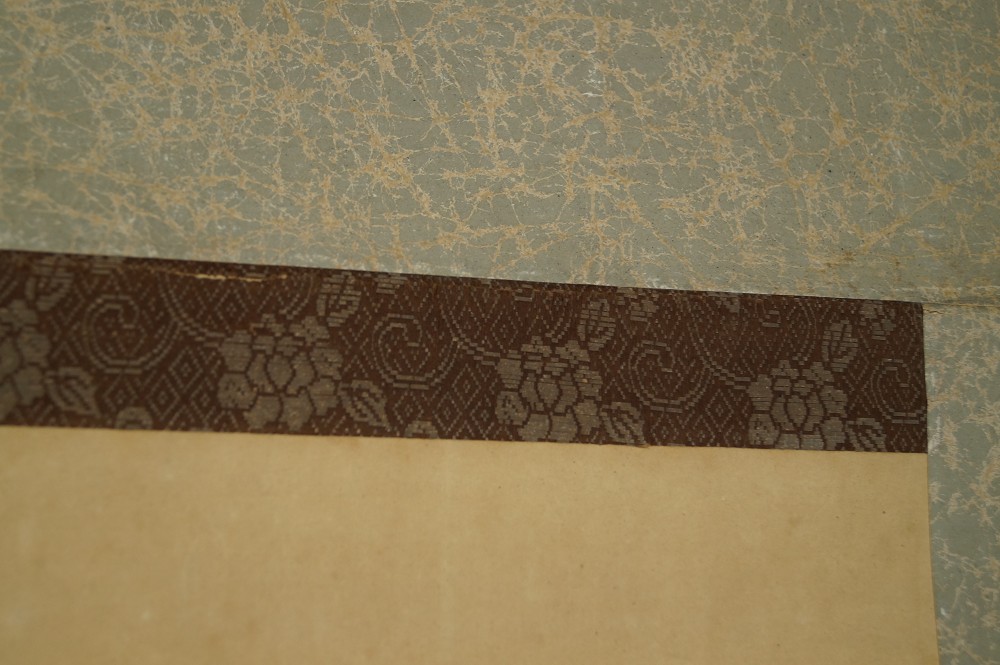 Hundewelpen im Gras Kakemono Montierungsdetail