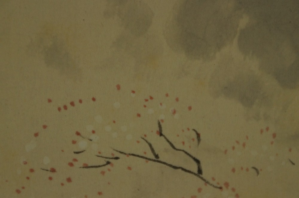Close-up of the delicately placed blossom dots against the ink cloud