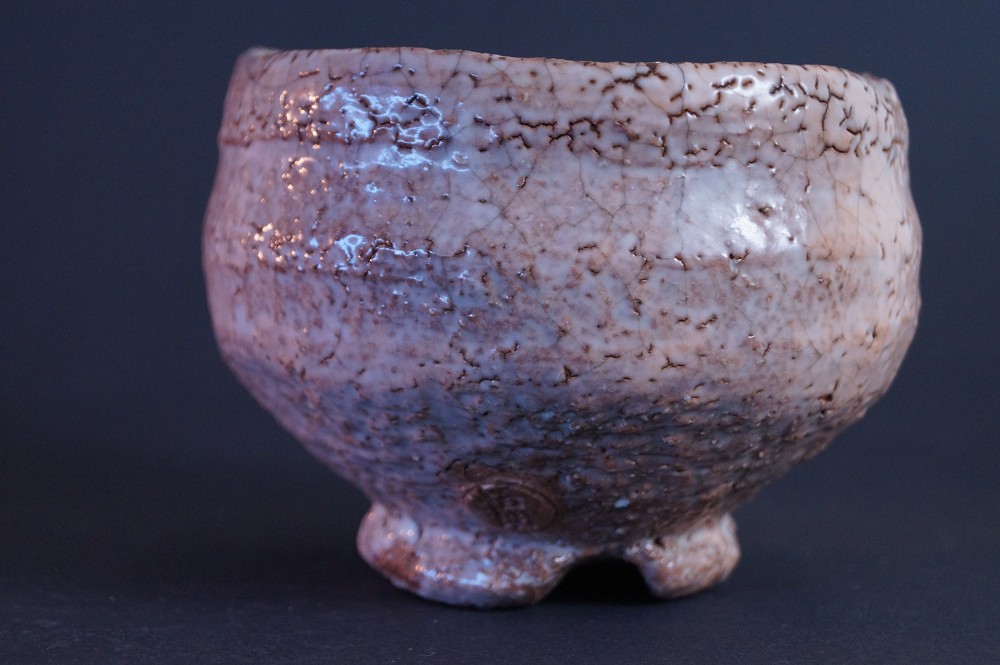 Further side view of the chawan with visible potter's mark on the foot