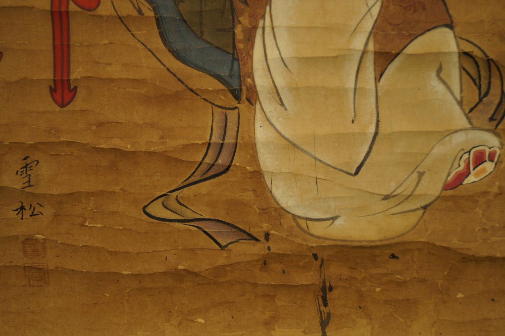 Signature and Seal Next to Flowing Robe Close-Up