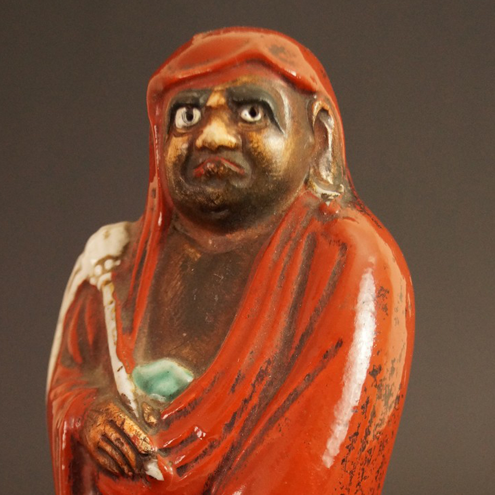 Bodhidharma Daruma Figur aus rotem Kutani-Porzellan Vorschau Nahaufnahme des Gesichts Motiv Nahaufnahme Vorschau