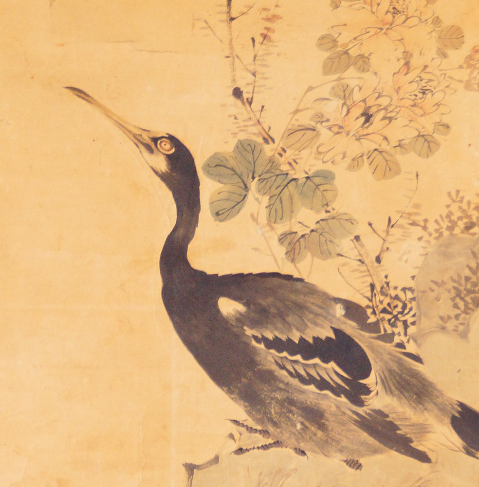 Heron standing on a rock with raised head next to chrysanthemum branches in the hanging scroll by Yamamoto Baiitsu