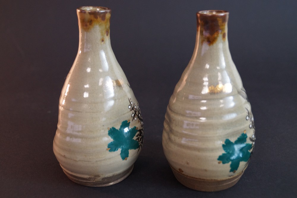 Further side view with turquoise leaf motif next to the black plum blossom branch