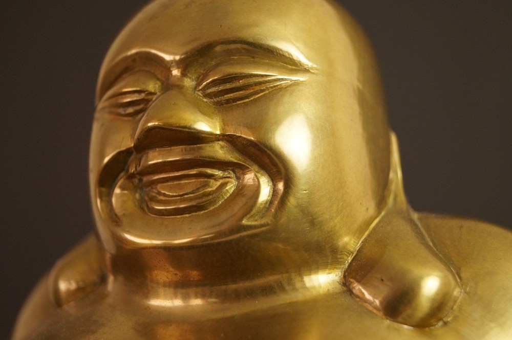 Hotei-Figur Gesicht-Motiv Nahaufnahme