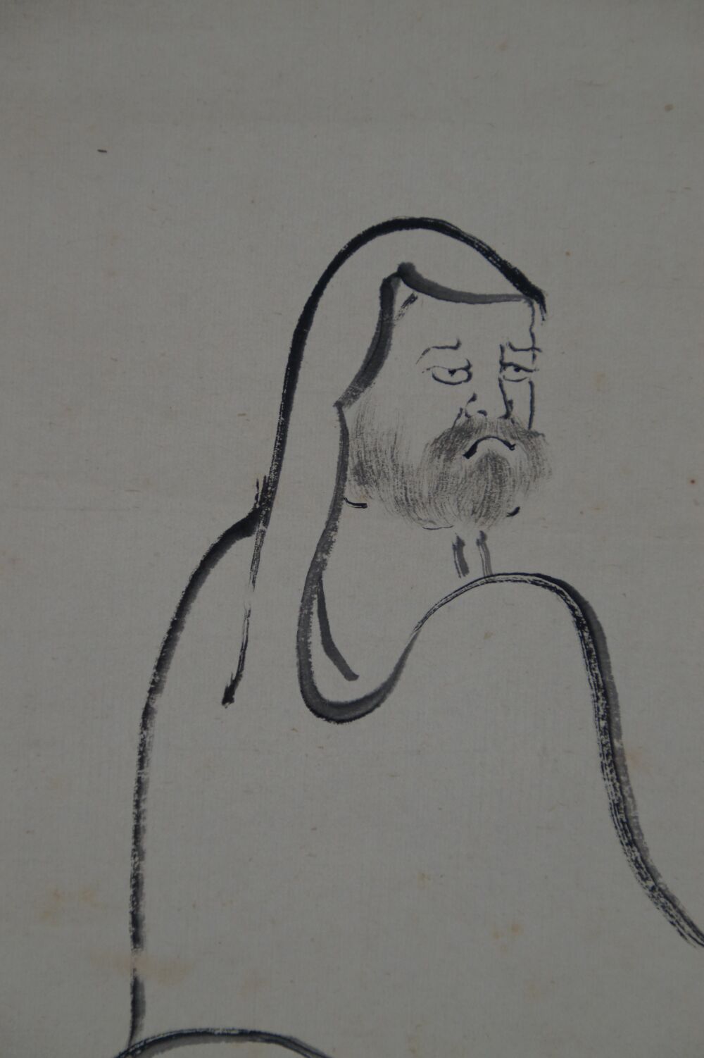 primer plano de la cabeza de Bodhidharma en el rollo colgante Bodhidharma directo al corazón