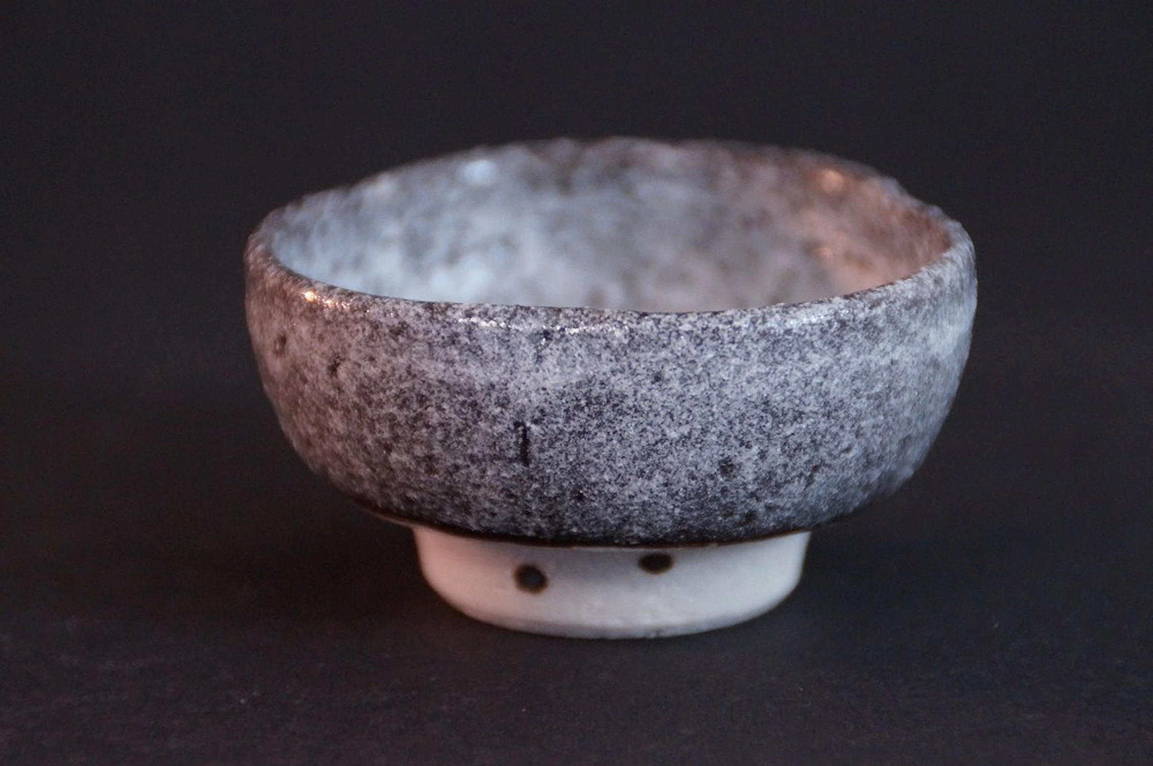 Front view of the handcrafted Shino sake cup