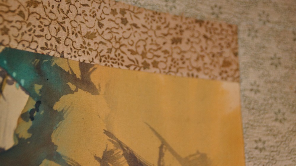 Detail of the upper mounting of the hanging scroll with brown vine brocade