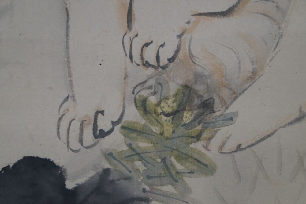Close-up of the paws with pine branch in the kakemono Puppy in the Sunset Glow Beneath Pines