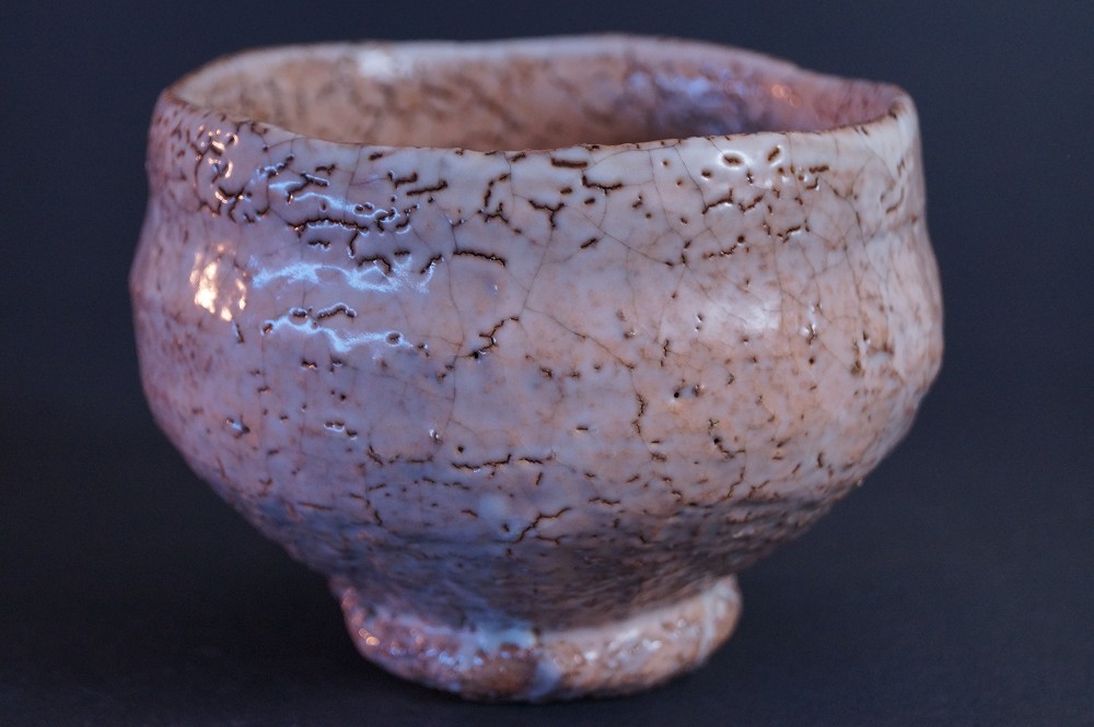 Back view of the chawan with pink to cream-colored glaze