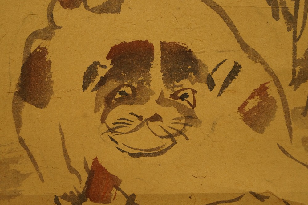Puppy under bamboo motif close-up 1