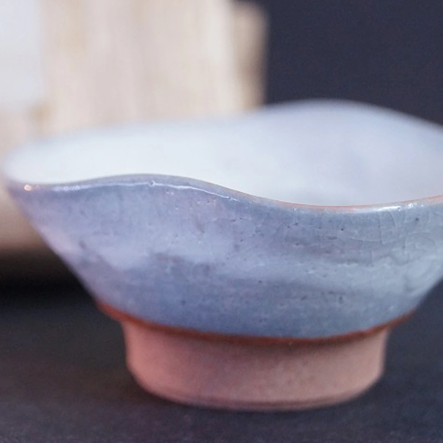 Preview close-up of the Seto sake cup with storage box in the background